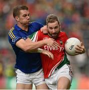 30 August 2014; Michael Conroy, Mayo, in action against Marc Ó Sé, Kerry. GAA Football All Ireland Senior Championship, Semi-Final Replay, Kerry v Mayo, Gaelic Grounds, Limerick. Picture credit: Barry Cregg / SPORTSFILE