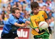 31 August 2014; Fionntáin O'Reilly, Butlersbridge N.S, Cavan, representing Donegal, in action against Luke Donnelly, Roan Primary School, Tyrone, representing Dublin, during the INTO/RESPECT Exhibition GoGames. Croke Park, Dublin. Picture credit: Ramsey Cardy / SPORTSFILE