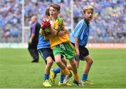 31 August 2014; Matthew Downey, St. Brigid's, Mayogall, Knockloughrim, Derry, representing Donegal, in action against Tom Gray, Harestown N.S, Louth, representing Dublin, during the INTO/RESPECT Exhibition GoGames. Croke Park, Dublin. Picture credit: Ramsey Cardy / SPORTSFILE