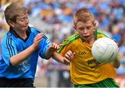 31 August 2014; Joseph Hughes, Scoil Mhuire na mBuachaillí, Monaghan, representing Donegal, in action against Darragh O'Sullivan Connell, Murrintown N.S, Wexford, representing Dublin, during the INTO/RESPECT Exhibition GoGames. Croke Park, Dublin. Picture credit: Ramsey Cardy / SPORTSFILE
