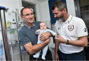 2 September 2014; Republic of Ireland manager Martin O'Neill, left, and assistant manager Roy Keane with Eoin Conroy, 8 weeks old, from Castleknock, Co. Dublin, during a visit to Temple Street Childrens Hospital, Dublin. Picture credit: David Maher / SPORTSFILE