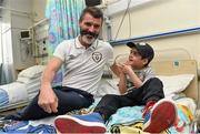 2 September 2014; Republic of Ireland assistant manager Roy Keane with Alex O'Keeffe, age 6, from Tallaght, Co. Dublin, during a visit to Temple Street Childrens Hospital, Dublin. Picture credit: David Maher / SPORTSFILE