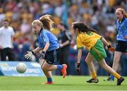 31 August 2014; Darina McGoldrick, St. Teresa's N.S, Clontumpler, Longford, representing Dublin, in action against Louise Ní Dochartaigh, Scoil na Carraige, Donegal, representing Donegal, during the INTO/RESPECT Exhibition GoGames. Croke Park, Dublin. Picture credit: Brendan Moran / SPORTSFILE
