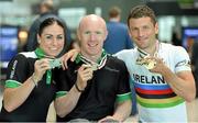 3 September 2014; The Irish Paracycling Team returned from the 2014 UCI Paracycling Road World Championships in Greenville, USA. The Irish team of five bikes won a total of four medals; Eoghan Clifford won double gold in the time trial and road race C3 class, Katie George Dunlevy and Eve McCrystal won silver in the visually impaired tandem road race and handcyclist Mark Rohan who won bronze in the H2 time trial. Pictured on their arrival is, from left, silver medalist tandem pilot Eve McCrystal, from Dundalk, Co. Louth, handcyclist Mark Rohan, from Ballinahown, Co. Westmeath, won bronze in the H2 time trial and Eoghan Clifford, from Galway Bay CC, Co. Galway, who won double gold in the time trial and road race C3 class. Dublin Airport, Dublin. Picture credit: Stephen McCarthy / SPORTSFILE