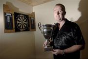 22 December 2006; Mick 'The Magnet' McGowan with his 3rd place trophy from the Antwerp Open at his home in Balbriggan. Soon he departs for his match against Phil 'The Power' Taylor on 26th December in the PDC Ladbrokes.com World Darts Championship which takes place in The Circus Tavern, Essex, England. Picture credit: Brian Lawless / SPORTSFILE