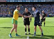 31 August 2014; Team captains Michael Murphy, left, Donegal, and Stephen Cluxton, Dublin, shake hands in the company oif referee Joe McQuillan before the game. GAA Football All Ireland Senior Championship, Semi-Final, Dublin v Donegal, Croke Park, Dublin. Picture credit: Brendan Moran / SPORTSFILE