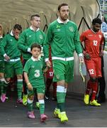 3 September 2014; Republic of Ireland captain Richard Keogh, with goalkeeper Shay Given, behind, lead out the Republic of Ireland team before the start of the game. Three International Friendly, Republic of Ireland v Oman, Aviva Stadium, Lansdowne Road, Dublin. Picture credit: David Maher / SPORTSFILE