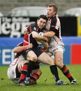 13 January 2007; Stephen Jones, Llanelli Scarlets, is tackled by Justin Harrison and Roger Wilson, Ulster . Heineken Cup, Pool 5, Round 5, Ulster v Llanelli Scarlets, Ravenhill Park, Belfast, Co. Antrim. Picture credit: Oliver McVeigh / SPORTSFILE