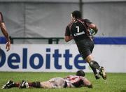 13 January 2007; Gavin Thomas, Llanelli Scarlets, runs in his sides fifth try after a failed tackled by Tommy Bowe, Ulster . Heineken Cup, Pool 5, Round 5, Ulster v Llanelli Scarlets, Ravenhill Park, Belfast, Co. Antrim. Picture credit: Oliver McVeigh / SPORTSFILE