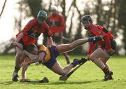 14 January 2007; Declan O'Rourke, Clare, in action against Brian Moylan and Shane O'Neill, UCC. Waterford Crystal Cup, Preliminary Round, Clare v UCC, Meelick, Co. Clare. Picture credit: Kieran Clancy / SPORTSFILE