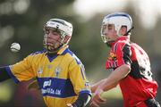 14 January 2007; Tyrone Kearse, Clare, in action against Stephen Cronin, UCC. Waterford Crystal Cup, Preliminary Round, Clare v UCC, Meelick, Co. Clare. Picture credit: Kieran Clancy / SPORTSFILE