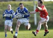 14 January 2007; Tom Kelly, Laois, in action against, Mark Stanfield, Louth. O'Byrne Cup Quarter-Final, Laois v Louth, McCann Park, Portarlington, Co. Laois. Picture credit: Brian Lawless / SPORTSFILE