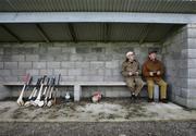 14 January 2007;  Pat O'Donnell, Clare hurlers sponsor, right, and his brother Owen watching the game from the dugout. Waterford Crystal Cup, Preliminary Round, Clare v UCC, Meelick, Co. Clare. Picture credit: Kieran Clancy / SPORTSFILE