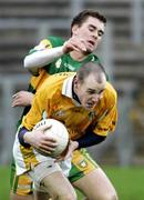 14 January 2007; Aidan Gallagher, Antrim, in action against Eamonne Magee, Donegal. McKenna Cup, Section C, 2nd Round, Antrim v Donegal, Casement Park, Belfast, Co. Antrim. Picture credit: Russell Pritchard  / SPORTSFILE