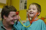 15 January 2007; Irish Rugby Captain Brian O’Driscoll announced that Temple Street Children's University Hospital has been named the Tesco Charity of the Year for 2007. Brian, a long time supporter of the hospital, met with staff and patients before making the official announcement. &quot;I am really pleased to announce that Temple Street has been chosen to be the Tesco Charity of the Year for 2007. This is a fantastic fundraising opportunity for the hospital and I am sure that it will prove to be a very exciting and successful year for all involved.&quot; Checking out Brian's wellbeing is Dylan Walsh, age 5, from Thurles, Co. Tipperary. Temple Street Childrens Hospital, Dublin. Picture credit: Brendan Moran / SPORTSFILE