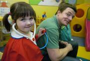 15 January 2007; Irish Rugby Captain Brian O’Driscoll announced that Temple Street Children's University Hospital has been named the Tesco Charity of the Year for 2007. Brian, a long time supporter of the hospital, met with staff and patients before making the official announcement. &quot;I am really pleased to announce that Temple Street has been chosen to be the Tesco Charity of the Year for 2007. This is a fantastic fundraising opportunity for the hospital and I am sure that it will prove to be a very exciting and successful year for all involved.&quot; Checking out Brian's wellbeing is Eilis McGrory, age 3, from Inch Island, Co. Donegal. Temple Street Childrens Hospital, Dublin. Picture credit: Brendan Moran / SPORTSFILE
