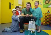 15 January 2007; Irish Rugby Captain Brian O’Driscoll announced that Temple Street Children's University Hospital has been named the Tesco Charity of the Year for 2007. Brian, a long time supporter of the hospital, met with staff and patients before making the official announcement. &quot;I am really pleased to announce that Temple Street has been chosen to be the Tesco Charity of the Year for 2007. This is a fantastic fundraising opportunity for the hospital and I am sure that it will prove to be a very exciting and successful year for all involved.&quot; Checking out Brian's wellbeing are, from left, James Daedall, age 4, from Clonsilla, Co. Dublin, Eilis McGrory, age 3, from Inch Island, Co. Donegal and Dylan Walsh, age 5, from Thurles, Co. Tipperary. Temple Street Childrens Hospital, Dublin. Picture credit: Brendan Moran / SPORTSFILE