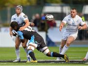 6 September 2014; Isaac Boss offloads to Leinster team-mate Cian Healy as he is tackled by Leone Nakarawa, Glasgow Warriors. Guinness PRO12, Round 1, Glasgow Warriors v Leinster. Scotstoun Stadium, Glasgow, Scotland. Picture credit: Stephen McCarthy / SPORTSFILE