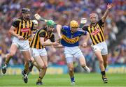 7 September 2014; Shane McGrath, Tipperary, in action against Kilkenny players from left, Jackie Tyrrell, Joey Holden and Cillian Buckley. GAA Hurling All Ireland Senior Championship Final, Kilkenny v Tipperary. Croke Park, Dublin. Picture credit: Pat Murphy / SPORTSFILE