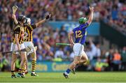7 September 2014; John O'Dwyer, Tipperary, celebrates after hitting a last minute free while Kilkenny players Aidan Fogarty, left, and TJ Reid look on. After consulting Hawkeye the free was adjudged to be wide and the game ended in a draw. GAA Hurling All Ireland Senior Championship Final, Kilkenny v Tipperary. Croke Park, Dublin. Picture credit: Pat Murphy / SPORTSFILE