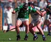 25 May 1997; Barry Foley of Limerick in action against Sean Cullinane of Waterford during the Munster Senior Hurling Championship Quarter-Final between Limerick and Waterford at Semple Stadium in Thurles, Co. Tipperary. Photo by Brendan Moran/Sportsfile