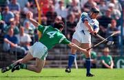 25 May 1997; Billy O'Sullivan of Waterford has a shot blocked by Declan Nash of Limerick during the Munster Senior Hurling Championship Quarter-Final between Limerick and Waterford at Semple Stadium in Thurles, Co. Tipperary. Photo by Brendan Moran/Sportsfile