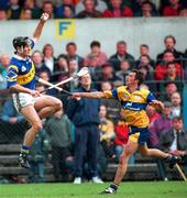 10 May 1997; Brendan Carroll of Tipperary in action against PJ O'Connell of Clare during the National Hurling League Division 1 match between Clare and Tipperary at Cusack Park in Ennis. Photo by Ray McManus/Sportsfile