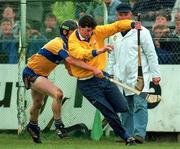 10 May 1997; Brendan Cummins of Tipperary is pressured by Niall Gilligan of Clare during the National Hurling League Division 1 match between Clare and Tipperary at Cusack Park in Ennis. Photo by Ray McManus/Sportsfile