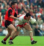 18 May 1997; Brian Dooher of Tyrone in action against Daniel Flynn of Down during the Ulster GAA Football Senior Championship Preliminary Round match between Down and Tyrone at St. Tiernach's Park in Clones. Photo by David Maher/Sportsfile