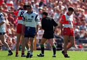 1 June 1997; Brian McCormack of Derry, right, leaves the pitch after being sent off by referee Martin McBrien during the Ulster GAA Football Senior Championship Quarter-Final between Monaghan and Derry at St. Tiernach's Park in Clones. Photo by Ray McManus/Sportsfile