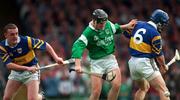 13 April 1997; Brian Tobin of Limerick in action against Colm Bonner and Stephen Hogan of Tipperary during the National Hurling League Division 1 match between Limerick v Tipperary at the Gaelic Grounds in Limerick. Photo by Brendan Moran/Sportsfile