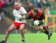 18 May 1997; Ciaran McCabe of Down in action against Paul Donnelly of Tyrone during the Ulster GAA Football Senior Championship Preliminary Round match between Down and Tyrone at St. Tiernach's Park in Clones. Photo by David Maher/Sportsfile