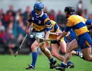 10 May 1997; Colm Bonner of Tipperary in action against Anthony Daly, behind, and David Forde of Clare during the National Hurling League Division 1 match between Clare and Tipperary at Cusack Park in Ennis. Photo by Ray McManus/Sportsfile