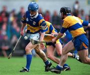 10 May 1997; Colm Bonner of Tipperary in action against David Forde of Clare during the National Hurling League Division 1 match between Clare and Tipperary at Cusack Park in Ennis. Photo by Ray McManus/Sportsfile