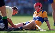 3 September 1995; Brian Lohan of Clare is treated for an injury by physio Colm Flynn during the All-Ireland Senior Hurling Championship Final between Clare and Offaly at Croke Park in Dublin. Photo by Ray McManus/Sportsfile