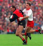 28 July 1996; Conor Deegan of Down is tackled by Pascal Canavan of Tyrone during the Ulster Senior Football Championship Final between Tyrone and Down at St. Tiernach's Park in Clones. Photo by David Maher/Sportsfile