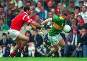 21 July 1996; Dara O'Cinneide of Kerry in action against Mark O'Connor of Cork during the Munster Senior Football Championship Final between Cork and Kerry at Pairc Ui Chaoimh, Cork. Photo by Ray McManus/Sportsfile