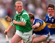 18 June 1995; Dave Clarke of Limerick gets past the challenge of Anthony Crosse and Michael Cleary of Tipperary during the Munster Senior Hurling Championship Semi-Final between Limerick and Tipperary at Páirc Uí Chaoimh, Cork. Photo by Ray McManus/Sportsfile