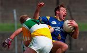 11 May 1997; Eugene McCormack of Longford is tackled by Anthony Kelly of Offaly during the Leinster GAA Senior Football Championship First Round match between Offaly and Longford at O'Connor Park, Tullamore. Photo by David Maher/Sportsfile