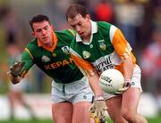 28 May 1995; Finbarr Cullen of Offaly in action against Evan Kelly of Meath during the Leinster Senior Football Championship Preliminary Round between Meath and Offaly in Pairc Tailteann, Navan. Photo by Ray McManus/Sportsfile