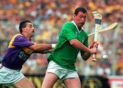1 September 1996; Frankie Carroll of Limerick in action against Martin Storey of Wexford during the GAA All-Ireland Senior Hurling Championship Final between Wexford and Limerick at Croke Park in Dublin. Photo by David Maher/Sportsfile