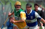 10 May 1997; Ger Oakley of Offaly in action against John O'Sullivan of Laois during the National Hurling League Division 1 match between Offaly and Laois at O'Connor Park, Tullamore. Photo by David Maher/Sportsfile