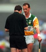 18 May 1997; Joe Dooley of Offaly receives a yellow card from referee Paddy Neary during the Leinster Senior Hurling Championship Preliminary Round match between Offaly and Meath at Cusack Park in Mullingar. Photo by Ray McManus/Sportsfile