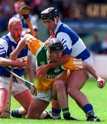 8 June 1997; Joe Errity of Offaly in action against Declan Conroy and Cyril Duggan of Laois during the GAA Leinster Senior Hurling Championship Quarter-Final between Offaly and Laois in Croke Park in Dublin. Photo by David Maher/Sportsfile