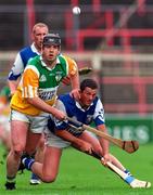 8 June 1997; Joe Errity of Offaly in action against John Taylor of Laois during the GAA Leinster Senior Hurling Championship Quarter-Final between Offaly and Laois in Croke Park in Dublin. Photo by David Maher/Sportsfile
