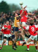 23 February 1997; Kevin Staunton of Knockmore contests a high-ball against Garvan Ware of Éire Óg during the All-Ireland Senior Club Football Championship Semi-Final between Knockmore and Éire Óg at Fr. O'Hara Memorial Park in Charlestown, Co Mayo. Photo by David Maher/Sportsfile