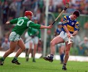 13 April 1997; Kevin Tucker of Tipperary in action against TJ Ryan of Limerick during the National Hurling League Division 1 match between Limerick v Tipperary at the Gaelic Grounds in Limerick. Photo by Brendan Moran/Sportsfile