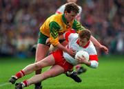 5 May 1996; Kieran McKeever of Derry in action against Tony Boyle of Donegal during the Church & General National Football League Final between Derry and Donegal at Croke Park in Dublin. Photo by Ray McManus/Sportsfile