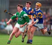 13 April 1997; Mark Foley of Limerick in action against Kevin Tucker and Liam Cahill of Tipperary during the National Hurling League Division 1 match between Limerick v Tipperary at the Gaelic Grounds in Limerick. Photo by Brendan Moran/Sportsfile