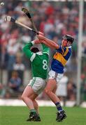 13 April 1997; Mike Houlihan of Limerick in action against Brendan Carroll of Tipperary during the National Hurling League Division 1 match between Limerick v Tipperary at the Gaelic Grounds in Limerick. Photo by Brendan Moran/Sportsfile